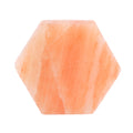 Hexagonal pink stone on a white background