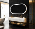 Modern bathroom with a black marble wall, oval mirror, and white bathtub.