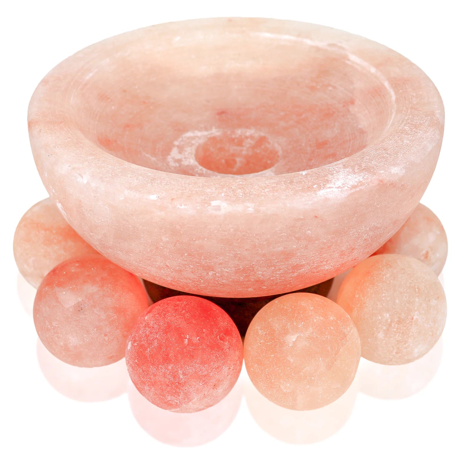 Pink crystal bowl with spherical crystals on a white background