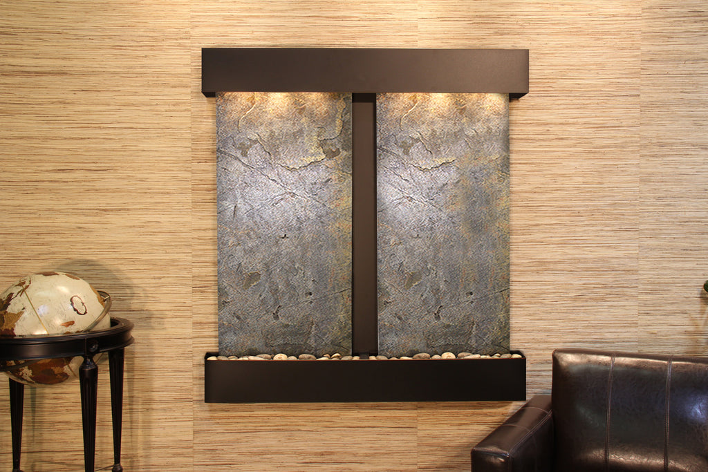 Two panel indoor fountain with couch and globe beside