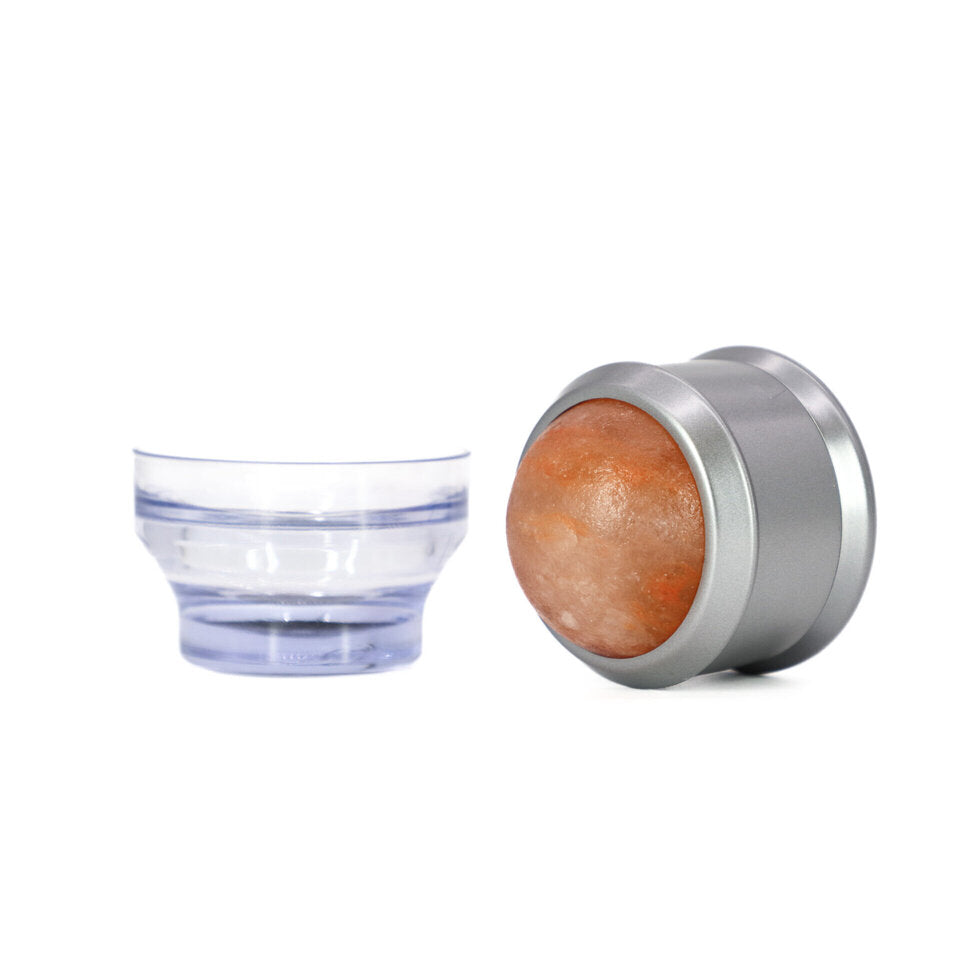 Clear plastic bowl and silver metal container with salt ball