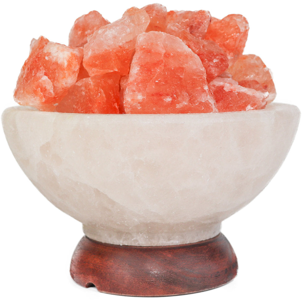 Himalayan salt lamp with pink crystals on a white background