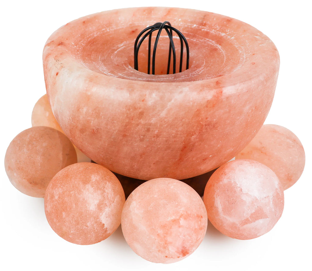 Himalayan salt lamp with spherical salt crystals on a white background