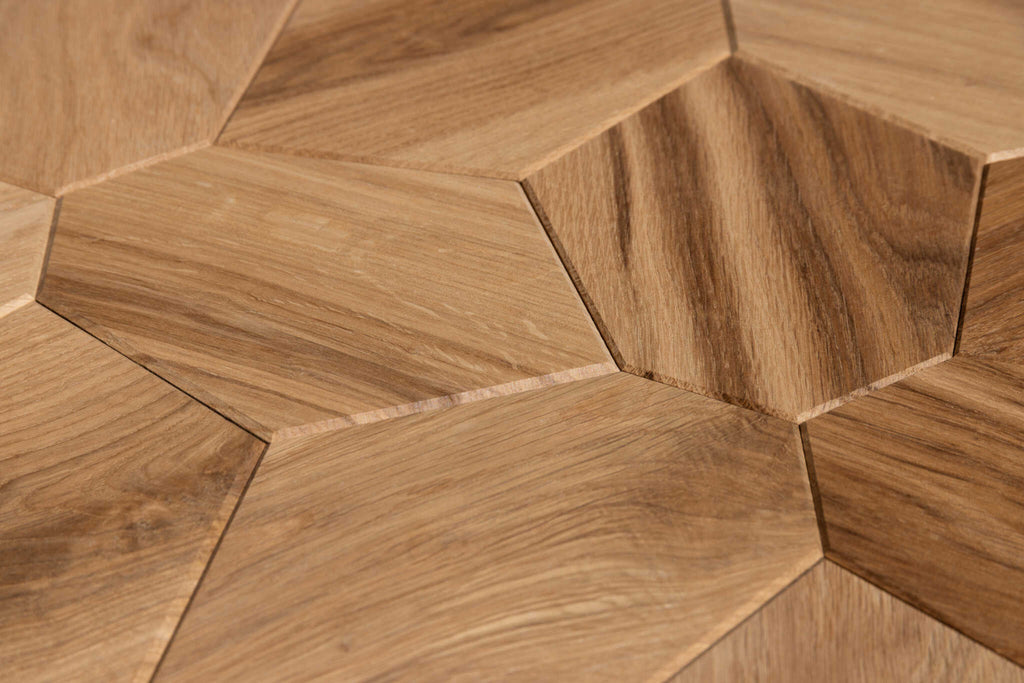 Close-up of hexagonal wooden tiles arranged in a herringbone pattern