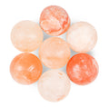 Set of round, salt stones on a white background