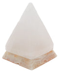 White pyramid salt lamp on marble base