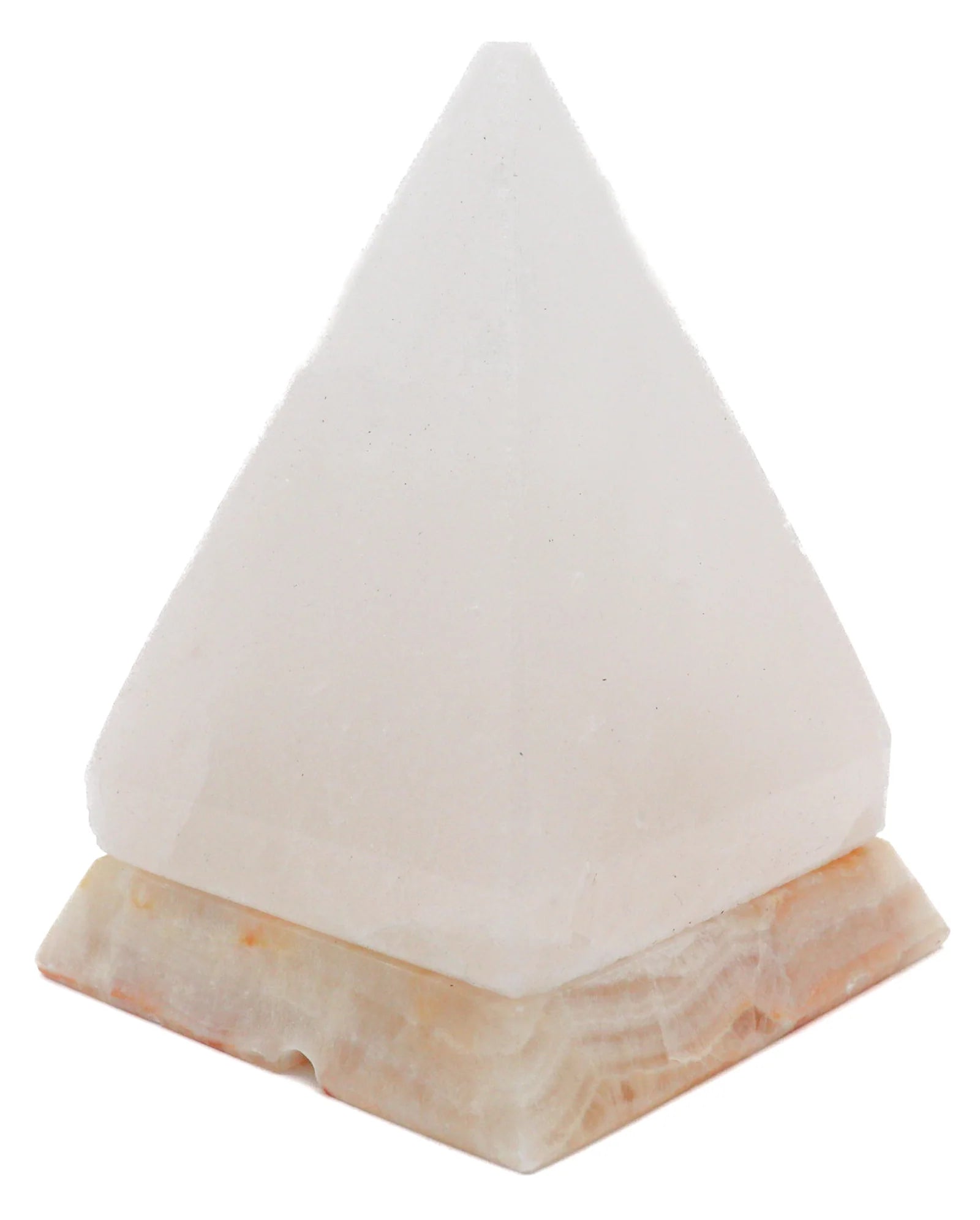 White pyramid salt lamp on marble base