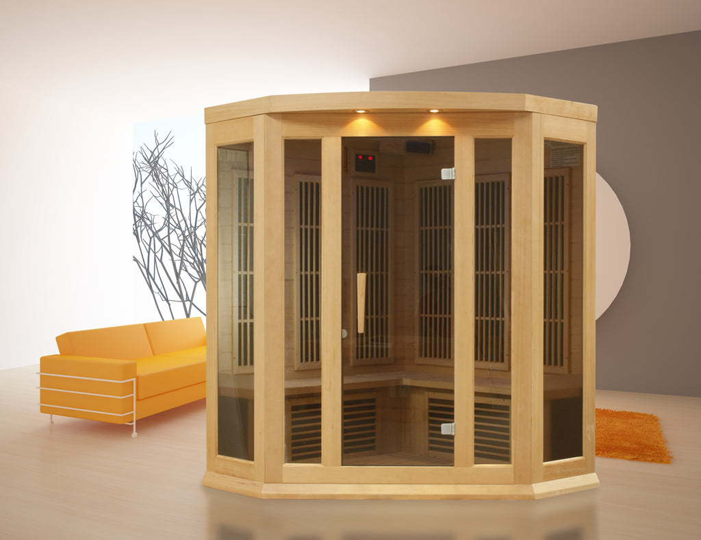 Wooden sauna in a room with an orange couch and gray wall.