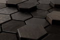 Hexagonal dark wooden tiles arranged in a pattern