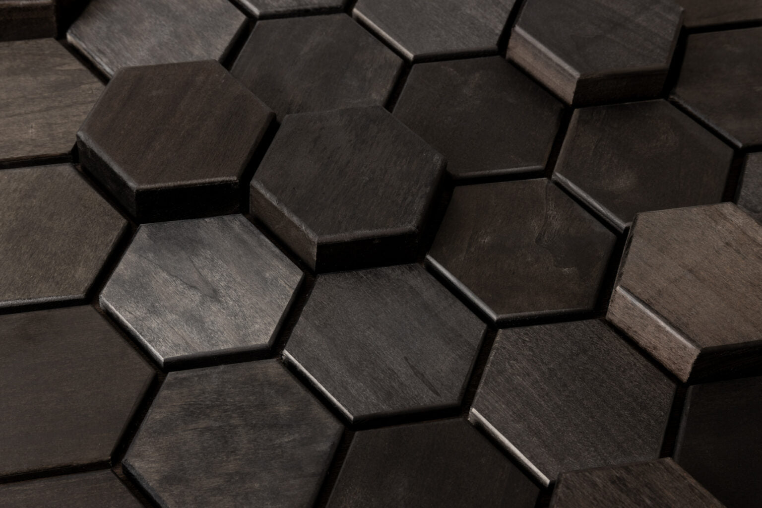 Hexagonal dark wood tiles arranged in a pattern