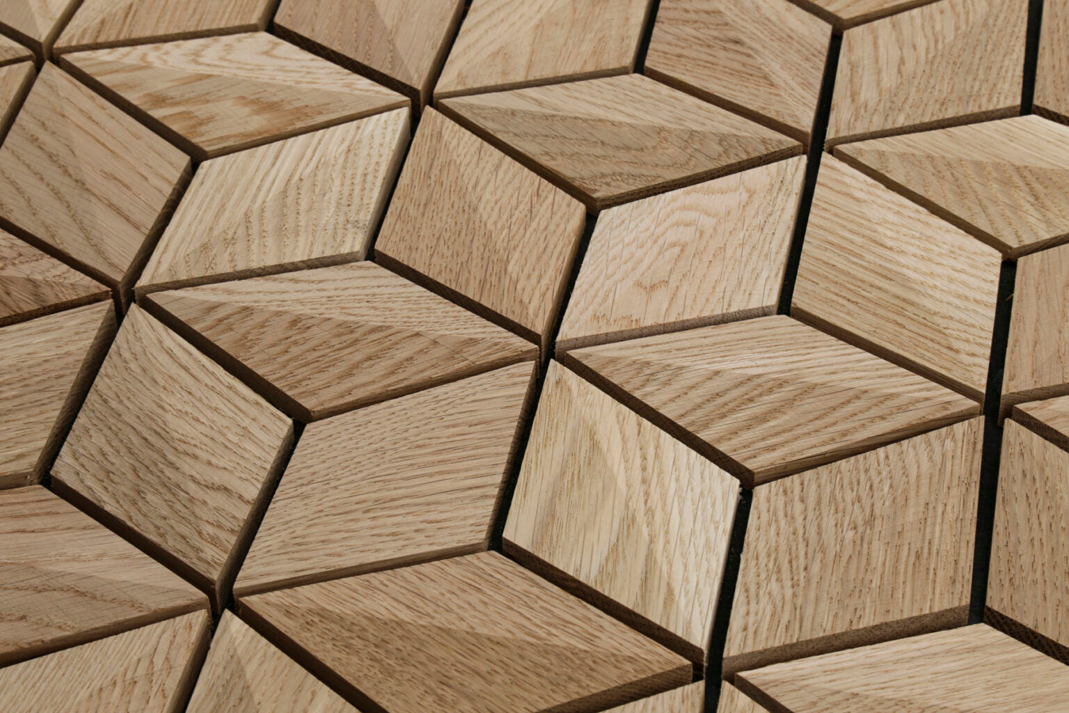 Geometric pattern of wooden tiles with a focus on texture and color variation.