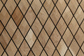 Wooden mosaic tile pattern with diamond shapes