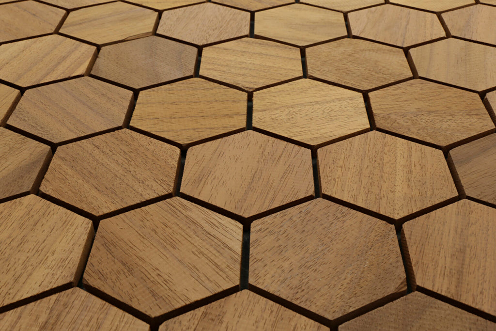 Hexagonal wooden flooring tiles arranged in a pattern