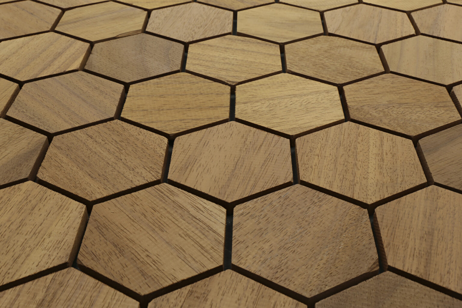 Hexagonal wooden flooring tiles arranged in a pattern
