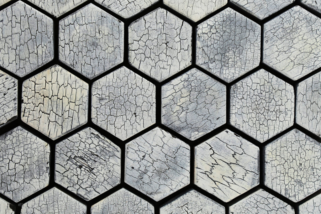Hexagonal stone tiles with a cracked surface pattern
