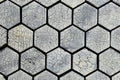 Hexagonal stone tiles with a cracked surface pattern