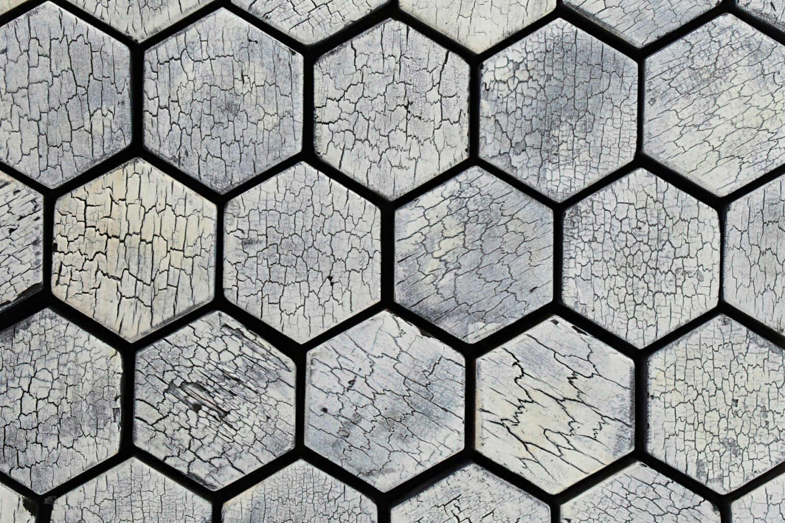 Hexagonal stone tiles with a cracked surface pattern