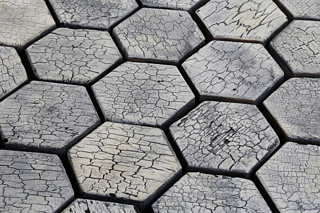 Hexagonal stone tiles with a cracked surface pattern