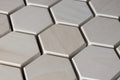 Close-up of hexagonal tiles with a metallic finish