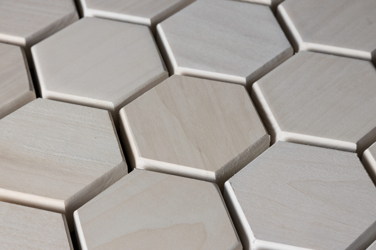 Close-up of hexagonal tiles with a metallic finish