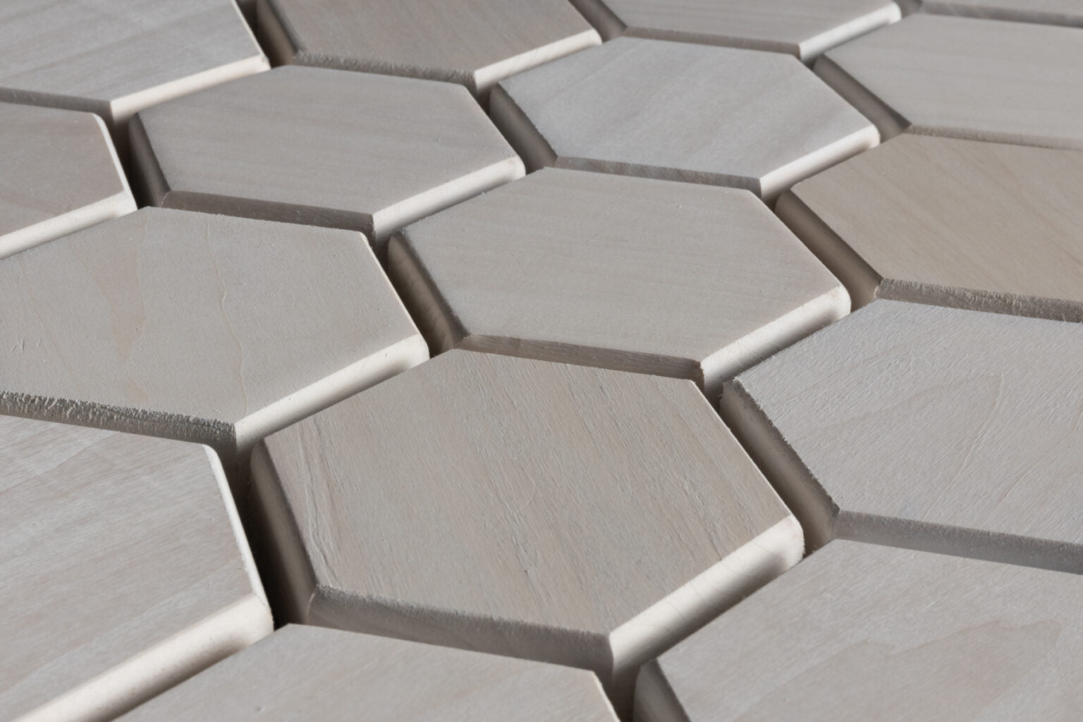 Hexagonal tiles in a pattern on a flat surface