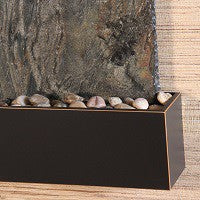 Rectangular trim with stones against a stone wall